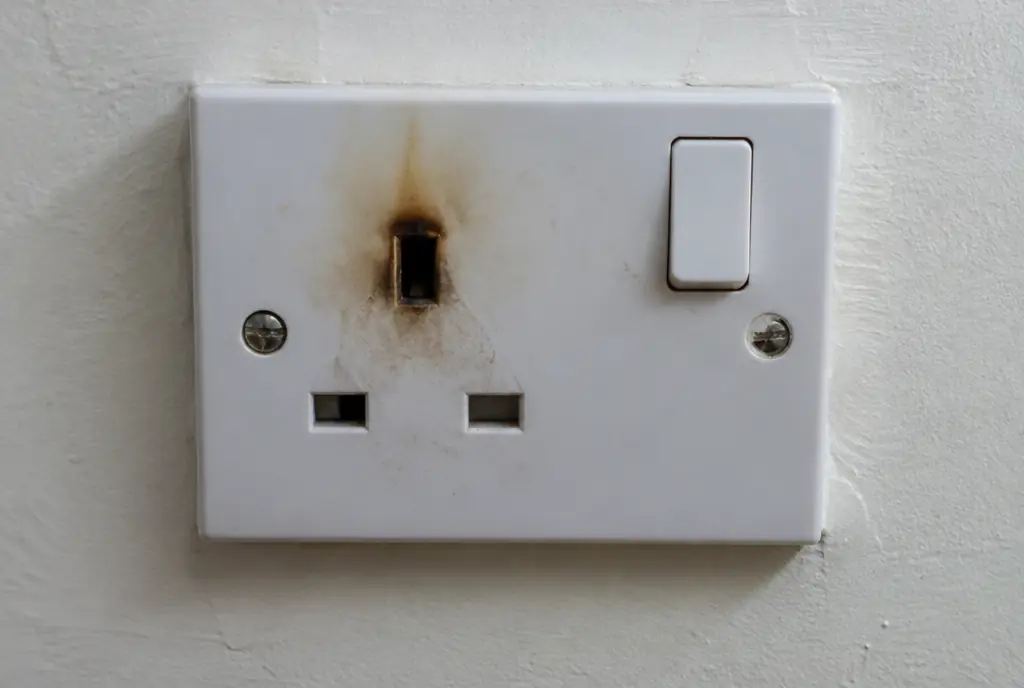 UK plug socket with brown scorch marks